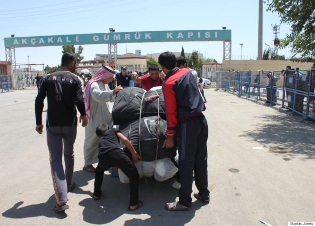 Syrians gather their belongings to return to Syria on June 17 after fleeing clashes between ISIS and Kurdish forces, backed by the FSA and US strikes, earlier in the week.