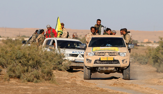 Syrian Democratic Forces ride in trucks south of Hasaka, Syria, Nov. 14, 2015. (photo by Serdar Mullah Darwish) 