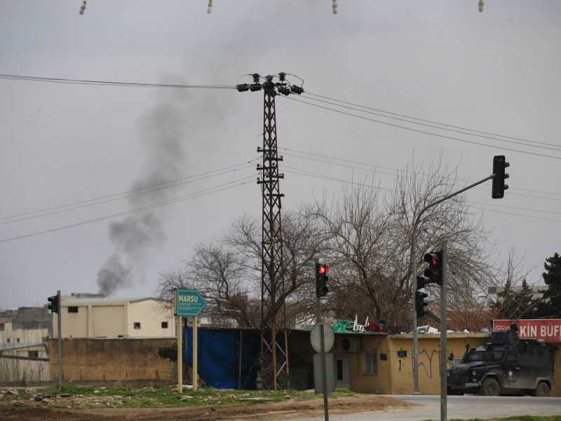 Smoke billows from a fire at the southeastern town of Nusaybin, Turkey, near the border with Syria, where Turkish security forces are battling militants linked to the outlawed Kurdistan Workers, Party or PKK, Sunday, Feb. 14, 2016, a day after Turkish media reports said a police officer was injured in a clash. The private Dogan news agency said the militants on Saturday detonated an explosive device in the town as a military vehicle was passing by, but no one injured. A second bomb was defused in a controlled explosion. (AP Photo/Lefteris Pitarakis)